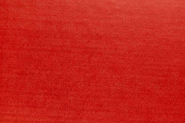 istock abstract red background  paper with bright center spotlight and black vignette border frame with vintage 1251335290