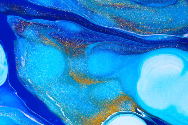istock Fluid art texture. Backdrop with abstract mixing paint effect. Liquid acrylic artwork that flows and splashes. Mixed paints for website background. Navy blue, golden and azure overflowing colors. 1251335752