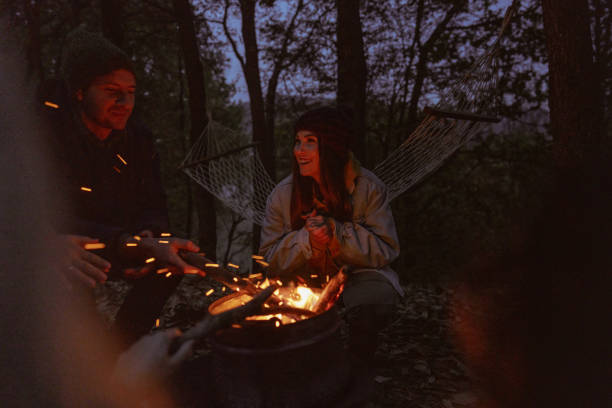 istock Friends enjoying by the campfire 1251337843