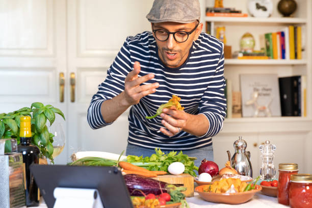 istock Happy man cooking lesson teaching online 1251339067