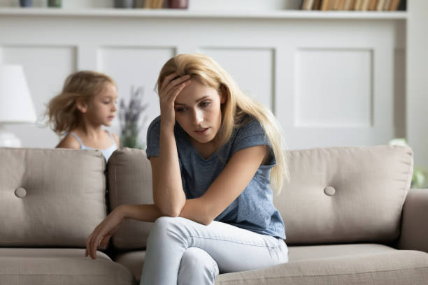 istock Tired nanny does not cope with capricious little kid girl 1251339082