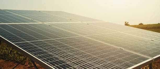 istock Solar panels with sunset and blue sky background. Clean power energy concept 1251339314