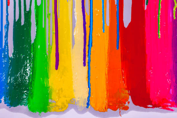 istock blue and purple colors dripping on rainbow color 1251339986