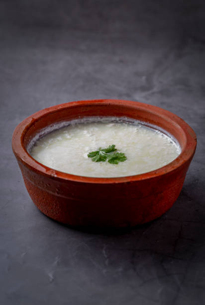 homemade curd in a clay pot freshly prepared curd kept in a clay pot to serve curd cheese stock pictures, royalty-free photos & images