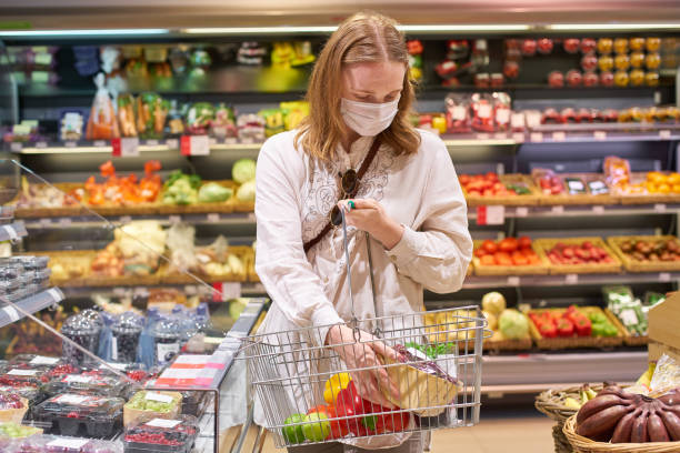 istock Woman grocery shopping 1251340129