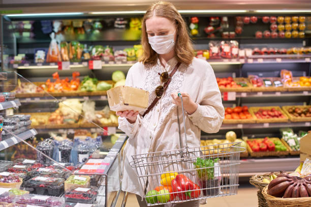 istock Woman grocery shopping 1251340140