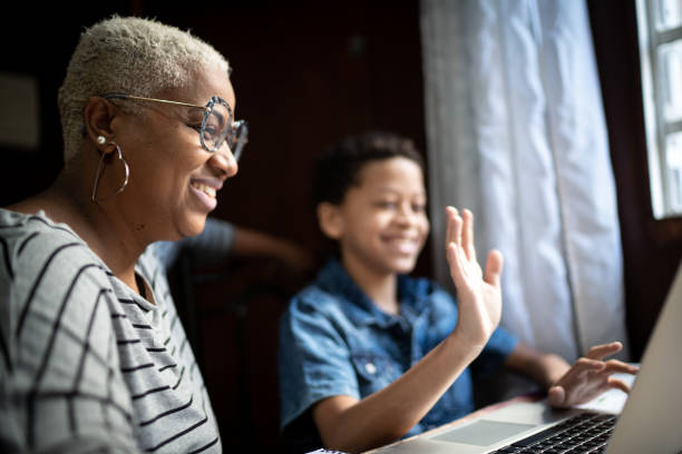 istock Mother and son studying with laptop at home 1251340339