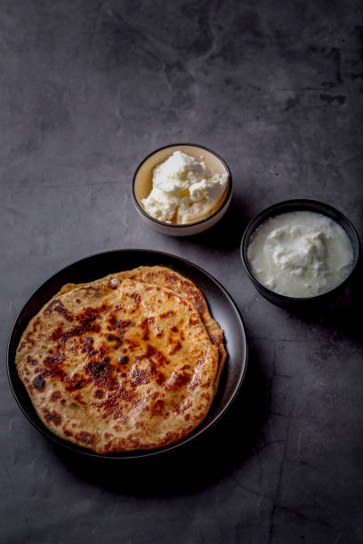 istock Aloo paratha or stuffed potato flatbread with curd and white butter 1251340783