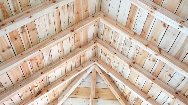 Wooden roof assembled of boards inside view from below