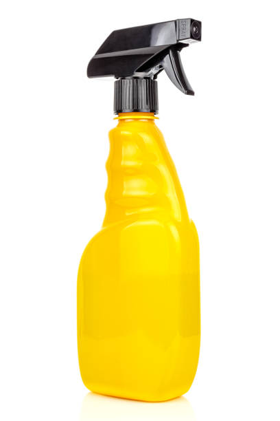 Bright yellow sprayer close-up isolated on white background