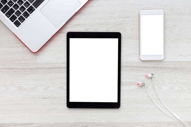 istock Workspace with Blank Screen Laptop and Smartphone 1251342168