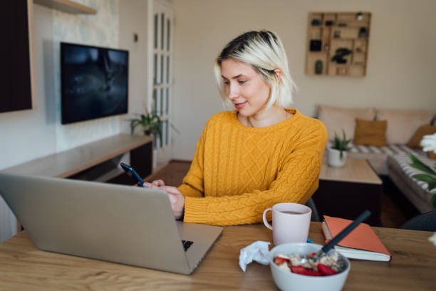 istock Young teacher starting her online work in the morning 1251342705
