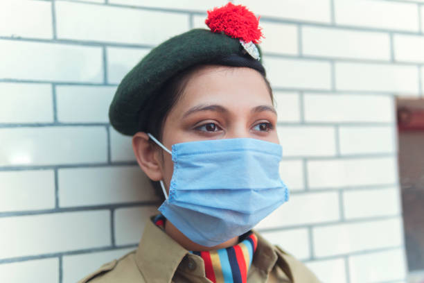 istock A young girl in NCC uniform and wearing protective mask. 1251342979