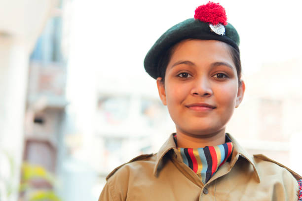 Portrait of happy young girl wearing NCC uniform. Indian Portrait of happy young girl wearing NCC uniform.outdoor shoot . copy space. indian navy stock pictures, royalty-free photos & images