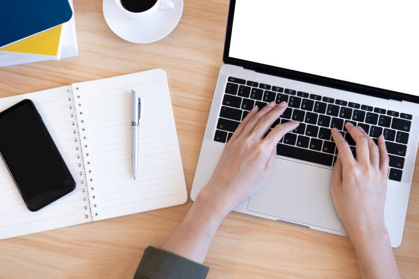 istock Modern young Asian woman working from home with top view. 1251343207