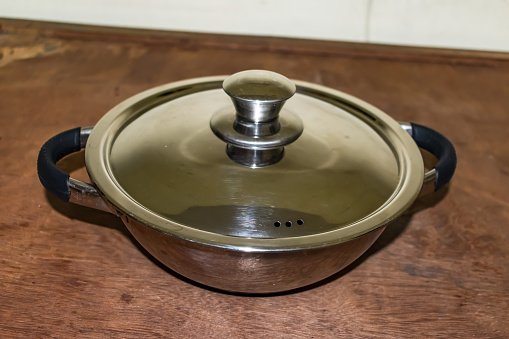 new pan made in stainless steel with chrome plated looking beautiful in floor.