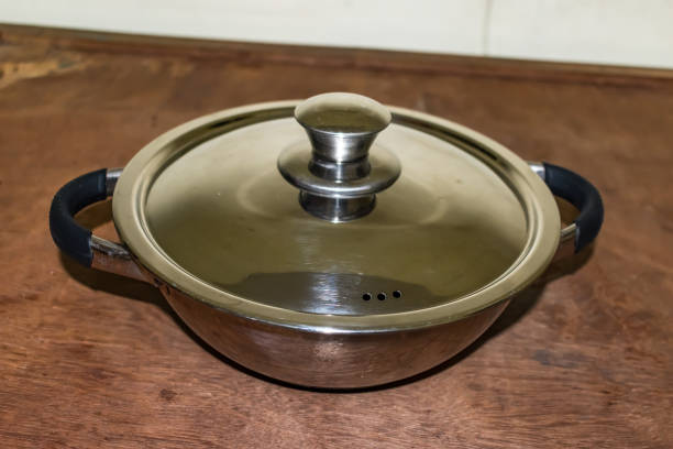new pan made in stainless steel with chrome plated looking beautiful in floor. stock photo