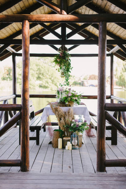 istock Table setting for a romantic dinner. Beautiful flowers in a vase on the table 1251344711