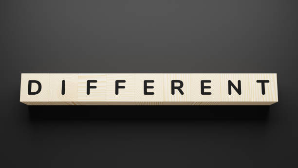 istock DIFFERENT word written in wooden blocks. 1251346038