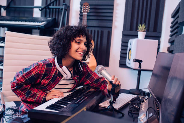 istock Young composer making a new song at her studio 1251347007