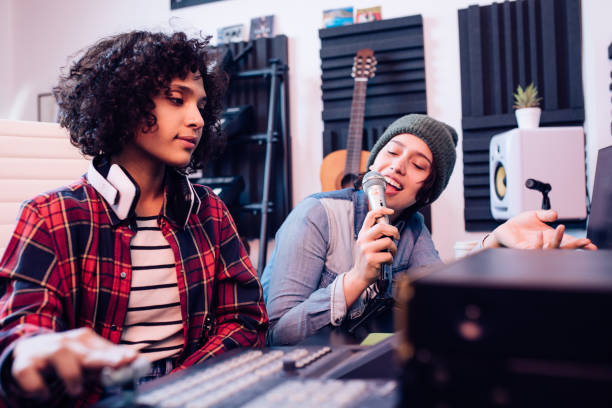 istock Two girls creating a new song in the studio 1251347145