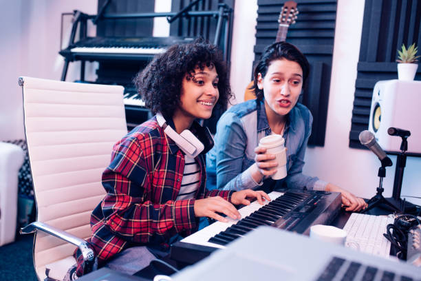 istock Two talented musicians composing music in the studio 1251347148