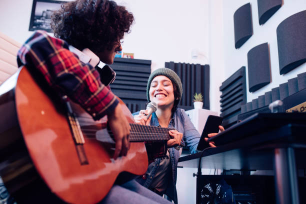 istock Two musicians creating a new song in the studio 1251347152