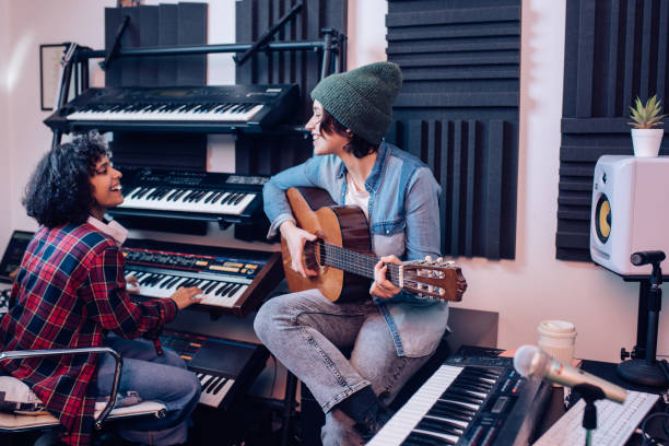 istock Two talented musicians creating a new song in the studio 1251347159