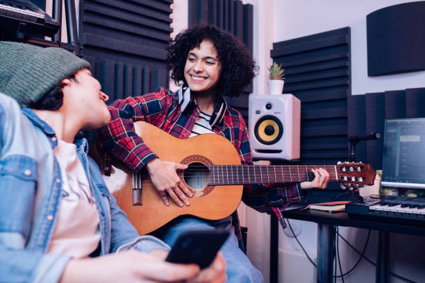 istock Two girls enjoying creating music together 1251347169