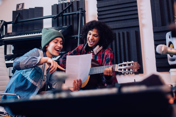 istock Two musicians composing a new song together 1251347175