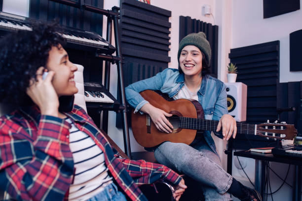 istock Young musicians recording music in the studio and having fun 1251347180