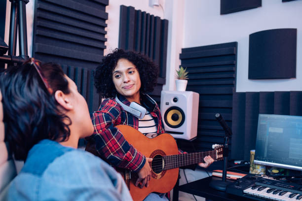 istock Creative female musicians recording music in the studio 1251347182
