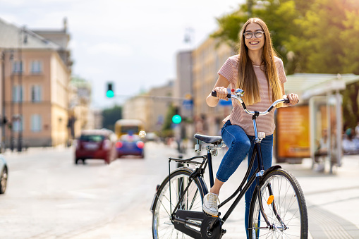 Young woman going for a bicycle ride