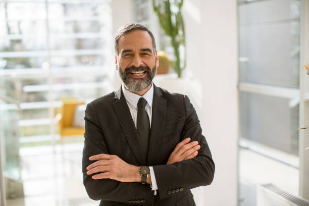 istock Mature businessman standing in an office 1251349059