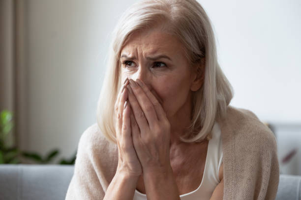 istock Head shot close up depressed middle aged woman crying. 1251349971