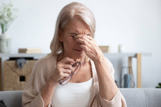 istock Tired older lady suffering from dry eyes syndrome. 1251349992
