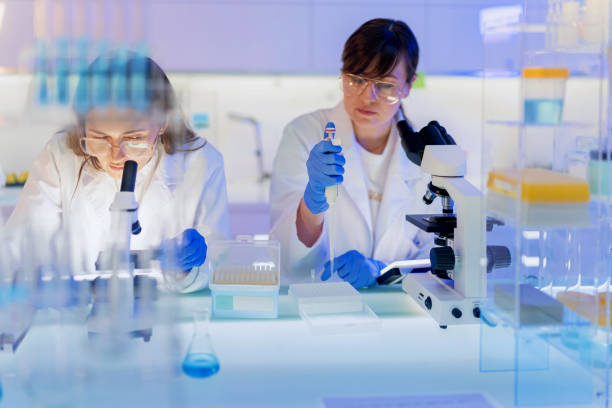 istock Female scientists during research. Studying samples in futuristic laboratory 1251350259