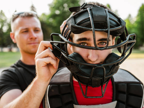 istock Young catcher and the coach 1251350472