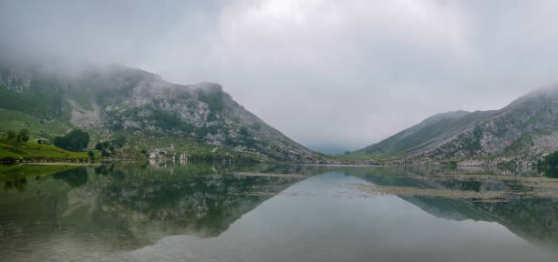 istock Lake surrounded by the mist 1251350770