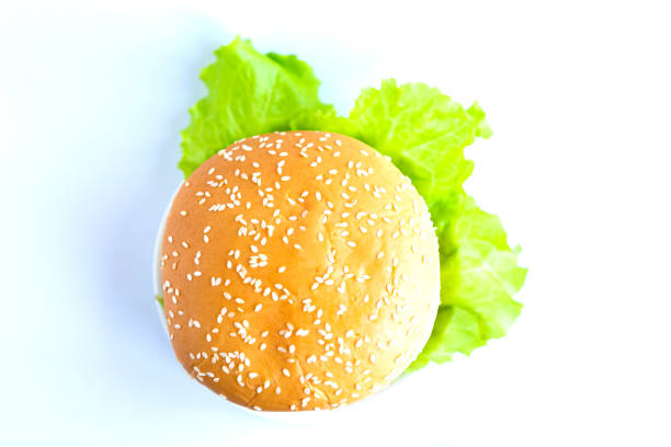 istock Fresh tasty hamburger on white background, top view 1251351330