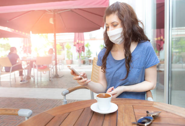 istock Woman with face protective mask 1251352359