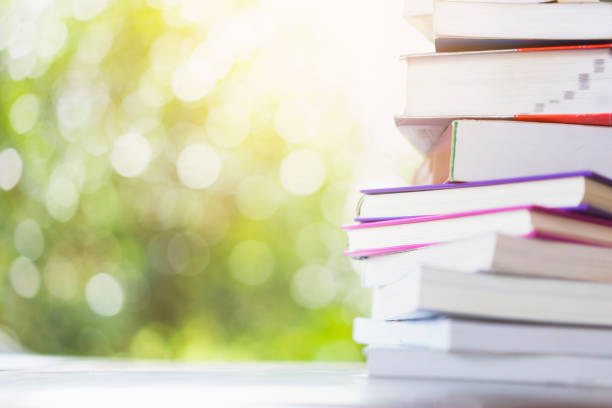 istock stack of books with green bokeh background 1251352737