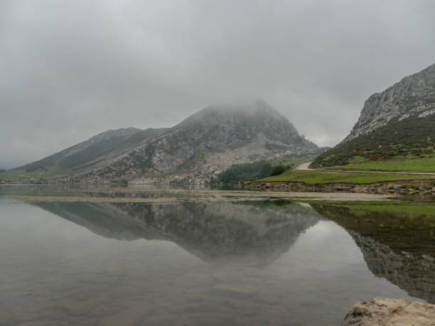istock Lake surrounded by the mist 1251352779