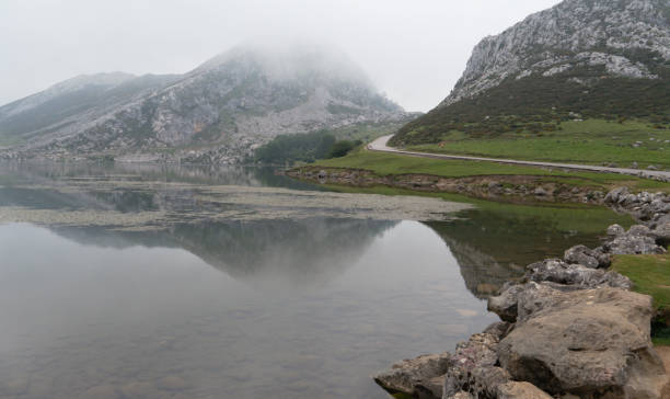 istock Lake surrounded by the mist 1251352795