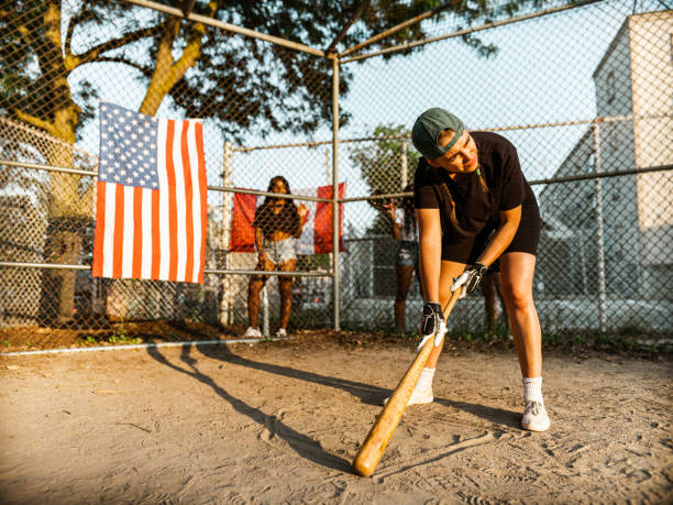 istock Diverse group of young women playing softball 1251353405