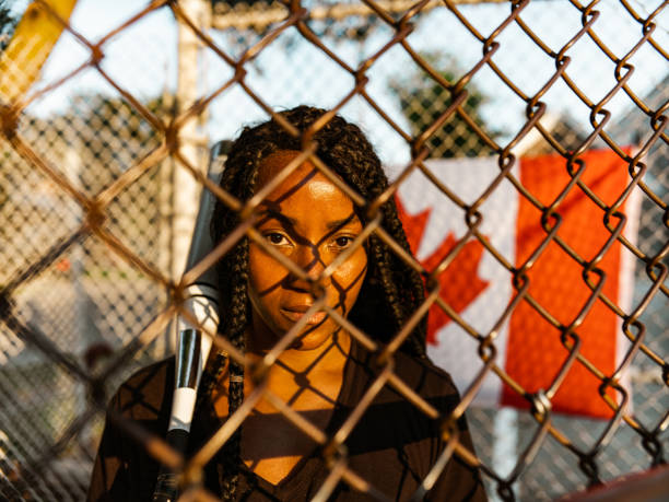 istock Young Black woman at the softball 1251353506