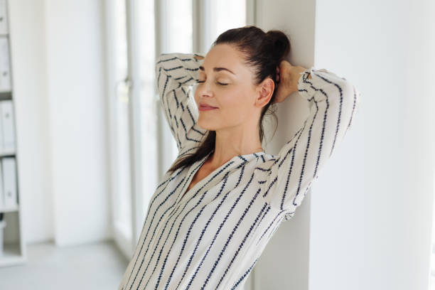 istock Young woman relaxing with eyes closed 1251353614