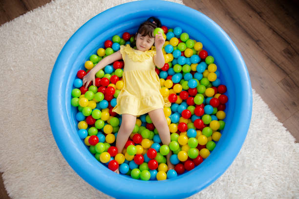 istock Little girl playing 1251353685
