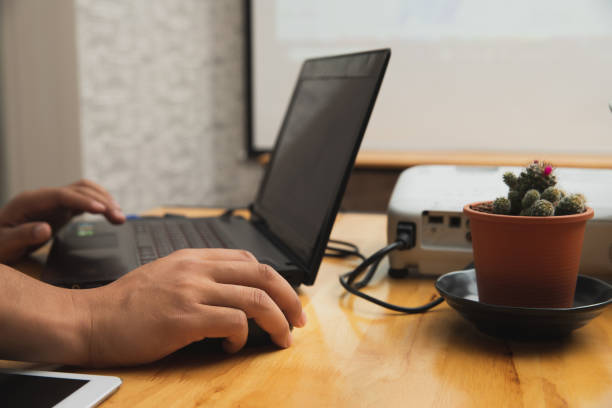 istock Businessman working remotely from his home office. A man using laptop while online conference. 1251354167