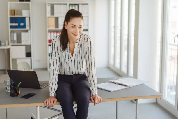 istock Relaxed friendly modern young businesswoman 1251354235